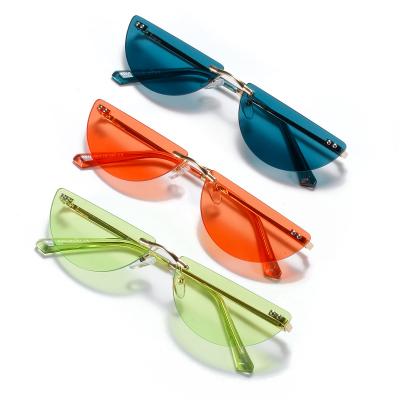 China Fashion Frameless Sunglasses Semicircle Metal Eyewear Hionable Colored Female Sunglasses for sale