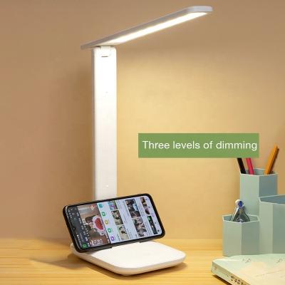 China As Stylish And Affordable Foldable Desk Lamp European LED Rotary Table Cell Phone Holder Lamp With Adjustable Brightness For Room Study for sale