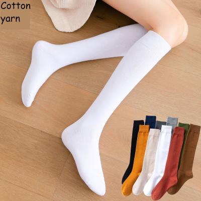 China QUICK DRY Women'S Autumn Pure Calf Cotton Yarn Thickened Girls Solid Half Length Black Knee High JK Student Socks for sale