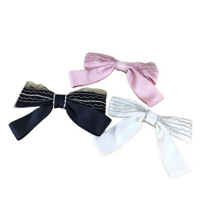 China New fashion ladies hair accessories girls hair bow pure color hairpins soft cute net rhinestone spring clips for sale