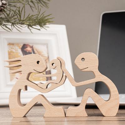 China Europe OEM Souvenir Table Decorations Home Wood Crafts Office Carving Wood Ornaments Carving Couples Family Member Baby Figurines for sale