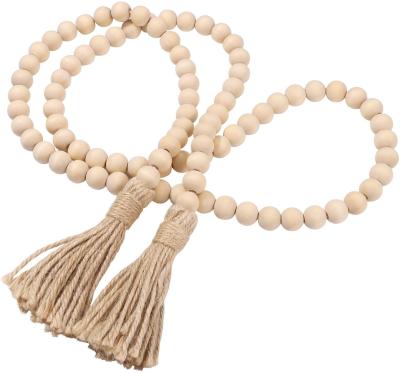 China Eco-Friendly Custom Rustic Farmhouse Beads Wooden Bead Garland with Tassels for Home Decor for sale