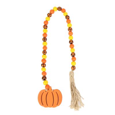 China New Customized Eco-Friendly Style DIY Rustic Christmas Ornaments Bead Wood Wreath With Pumpkin Tassels And Hangtag for sale