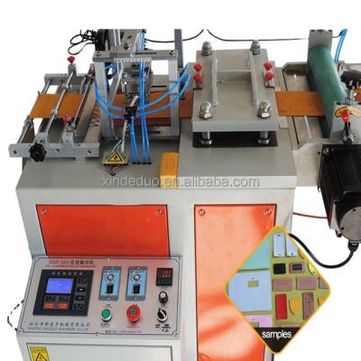 China Beverage Newcomer Embossed Technics And Leather Material Garment Labels Die Cutting Machine for sale