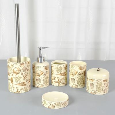 China JIA SHUN Viable 6 Piece Home Decor Bathroom Products Round Beige Glazed Ceramic Seashell Decal Bathroom Accessories Set for sale