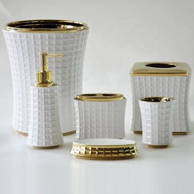 China Sustainable 6 Piece Lattice Design White Ceramic Gold Plating Bathroom Accessories Sets For Toilet for sale