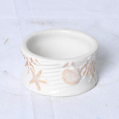 China JIA SHUN Wholesale Restaurant Hotel Home Accessories Home Accessories Beige Ceramic Orange Seashell Emboss Napkin Holder Ring for sale