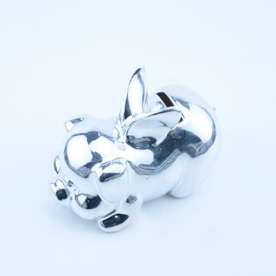 China Decoration factory hot sales white pig ceramic silver flying coin piggy bank for sale