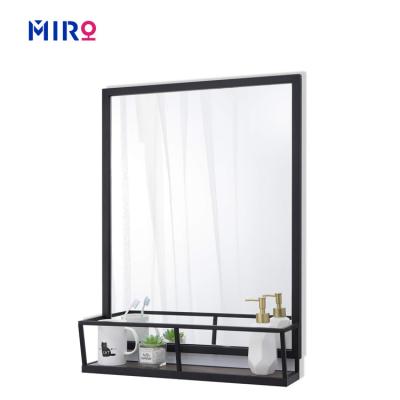 China Wholesale Magnifying Bathroom Black Metal Frame Wall Mirror With Shelf for sale