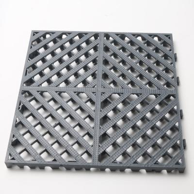 China PP Material Garage Event Flooring Durable Non Slip Durable Plastic Elastic Flooring Splice Tile Flooring en venta