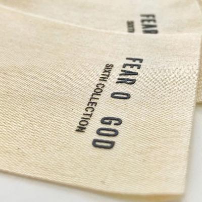 China Fashionable Simple Beige Silicone Cotton Labels 3D Labels Fashionable End Fold Label Clothes Accessories for sale