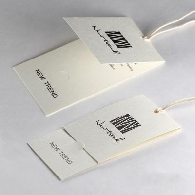 China Viable Wholesale Luxury Printed Special Paper Single Label Clothing Hanger Label for sale