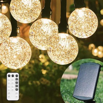 China HOT SALE Outdoor 70 LED Solar Lights 12m String Remote Control 40ft Crystal Globe Lights with RF Remote Wedding Party Christmas for sale