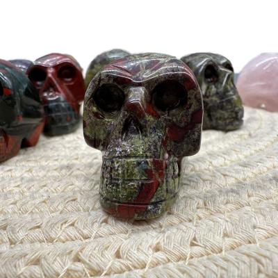 China Europe Hot Sale Natural Quartz Cranium Dragon Blood Stone Healing Crystal Skulls Craft Christmas Decoration for sale