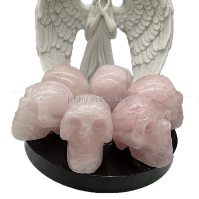 China Europe Natural Crystal Decorative  Hand Carved Crafts Rose Quartz Skulls Pink Crystal Skulls for sale