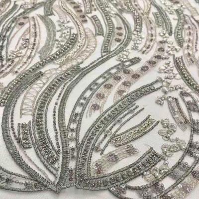 China Viable running lot lace sequins wedding embroidery fabric elegant bridal dress topone lace fabric for sale