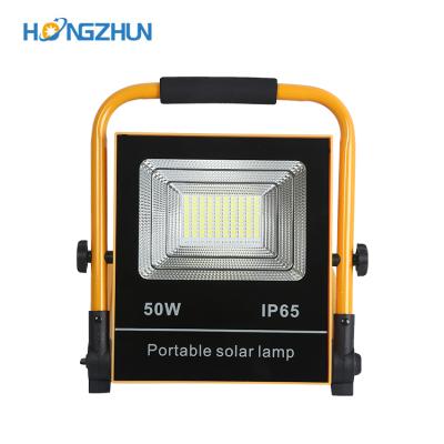 China Emergency ip66 waterproof outdoor portable rechargeable 50w 100w garden all in one solar led flood light for sale