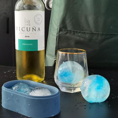 China DUMO Food Grade Silicone 2 Viable Cavities Round Ice Cube Tray Silicone Ice Maker Custom Ice Ball With Lid for sale