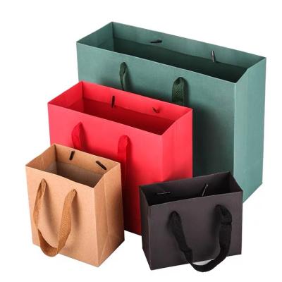 China Handmade wholesale paper handbags with custom logo for shops paper bags for shops printed logo for messenger retail clothing shoes gift for sale