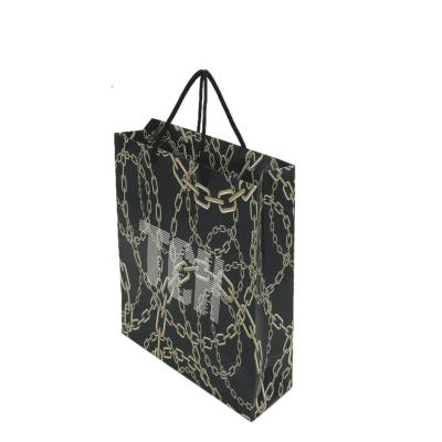 China Handmade wholesale china folding paper bag shops printed logo bags paper clothing shoes gift garment retail shiny newsagent for sale