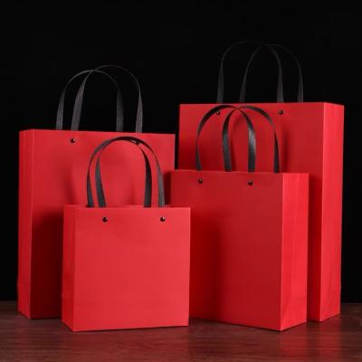 China Handmade Wholesale Custom Printed Gold Paper Bags New Year Promotional Red Chinese Shopping Paper Bag Printing Shopping Paper Bag With Logo for sale