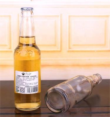 China Hot Sale Amber And Clear 330ml Empty Glass Beer Bottle Beverage For Sparkling Wine Alcohol Juice Beverage With Metal Crown Cap for sale