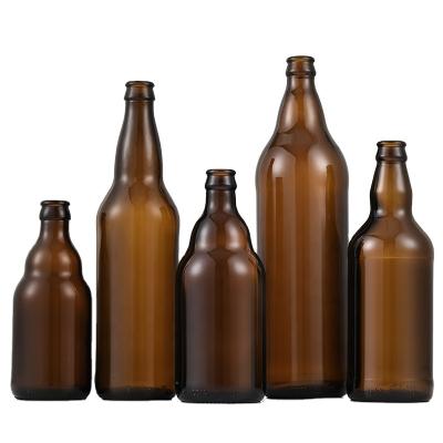 China Custom Beverage Beer Bottle 330ml Flint Amber Cobalt Blue Glass Bottle With Crown Cap for sale