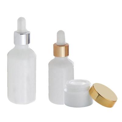 China New Design 5ml 10ml 15ml 20ml 30ml 50ml 100ml Opal Porcelain White Glass Cream Cosmetic Bottle With Gold Dropper Cap for sale