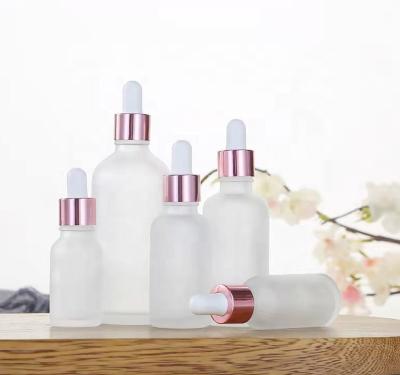 China Luxury Rose Pink Frosted Glass Dropper Bottle 30ml Serum Essential Oil with Rose Gold Droppers Cap Aromatherapy Bottles for Oils 30ml for sale