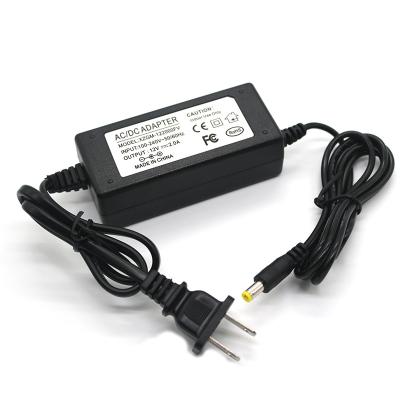 China Switch Power Adapter 12v 2a DC Male Connector Plastic Desktop AC Power Adapter DC For US EU AU UK Plug for sale