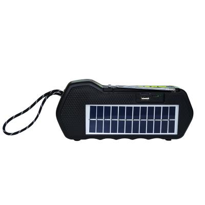 China ROAD Solar AM Torch/FM Radio Generator Mobile Phone Charger Power Supply LED Outdoor Handheld Solar Camping Spotlight for sale