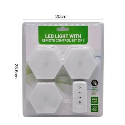 China New Wall Hexagon Light Honeycomb Light Bedroom Lamp Household Splicing Tapping Remote Control Light Modern Creative Combination Lamp for sale