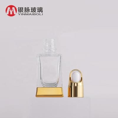 China Personal Care Square Bottle Bottle Essential Oil Glass Clear Cosmetic Bottle With Flower Basket Dropper Lid for sale