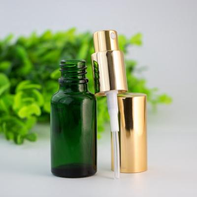 China Custom Green 20ml Personal Care Essential Oil Glass Dropper Bottle With 9mm Atomizer Spray Pump Gold Lid for sale