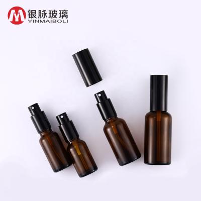 China Wholesale Personal Care Spray 30ml Amber Essential Oil Glass Cosmetic Perfume Bottle With Black Spray Cap for sale