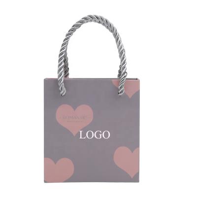 China Small Grocery Gift Retail Recyclable Gift Paper Goods Bags Factory Custom Logo With Nylon Handles Bulk for sale