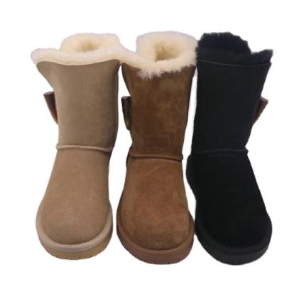 China Classic fashion trend one button snow sheepskin boots for women with genuine leather simple candy style for sale