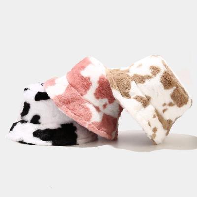 China Keep warm  Wholesale Winter black white Cow Print Fisherman Hats Faux Fur Furry Plush Fluffy Warm Bucket Hat for sale