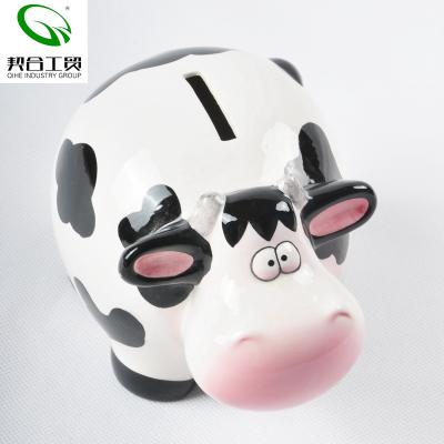 China Customized Ceramic Coin Bank Milk Cow Shape Phone Booth Savings Bank, Ceramic Animal Piggy Bank Design Money Bank for sale