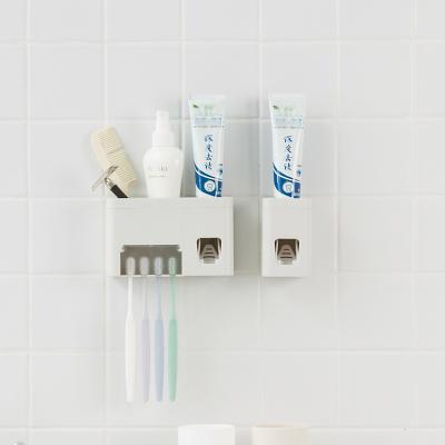 China Multifunctional Family Viable Bathroom Toothbrush Storage Rack Set Wall Mounted Toothpaste Dispenser Organizer Rack for sale