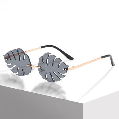 China Fashion Sunglasses 2022 Fashion Trending Women Rimless Leaves Frames Shades Sun Glasses Sun Glasses for sale