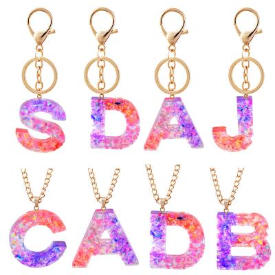 China Charm Bag Charm Jewelry Acrylic Color Key Chain Resin Stone News Key Chain Natural Resin Mixed Letters for sale