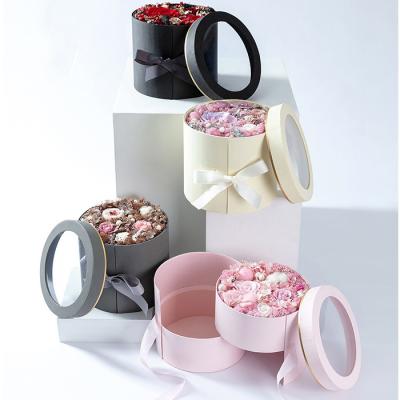 China Recyclable Double Layer Rotating Round Flower Box Layout Gift Love Rose Boxes With Clear Window for sale