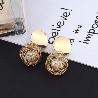 China FASHIONABLE European and American vintage palace cavity earrings cut out ear hook earrings temperament woven ball pearl stud earrings for sale