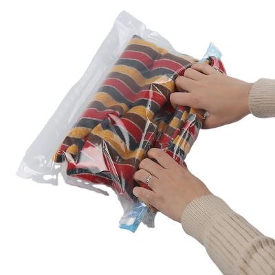 China Sustainable Hand Pressing Travel Vacuum Storage Bag Roll up Vacuum Space Bag for sale