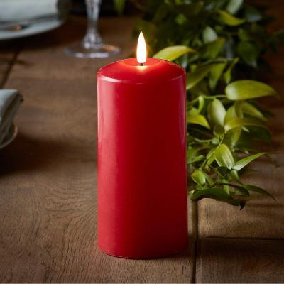 China Colorful Flame Red Wax LED Flameless Pillar Battery Operated Candle With Remote Control for sale