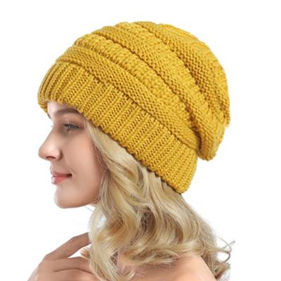 China COMMON Amazon Winter Hotselling Knitting Warm Hat Solid Color Knitted Ear Protection Beanie Satin Inner Lining Woolen Sweater Hats for sale