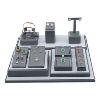 China New Soft Luxury Multifunctional Gray Leather Wooden Bracket Jewelry Display Props Set for sale