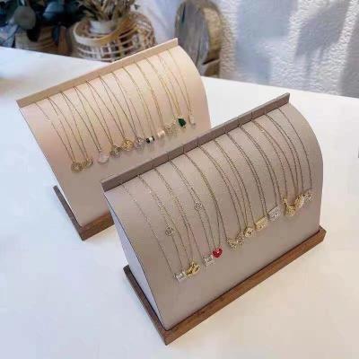 China Newest style soft simple vertical outlet factory necklace bracelet jewelry display stand leather jewelry rack for sale