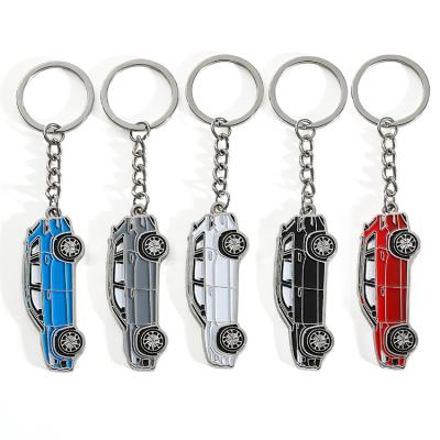 China Creative souvenir gift 3d metal brand logo style folder toy car new personalized key chain 3d metal personalized key chain for sale